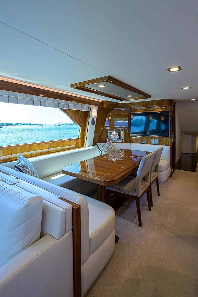 Slide: The Image of Luxurious interior of 2018 Viking 92 Sky Bridge yacht with elegant dining area. - 31
