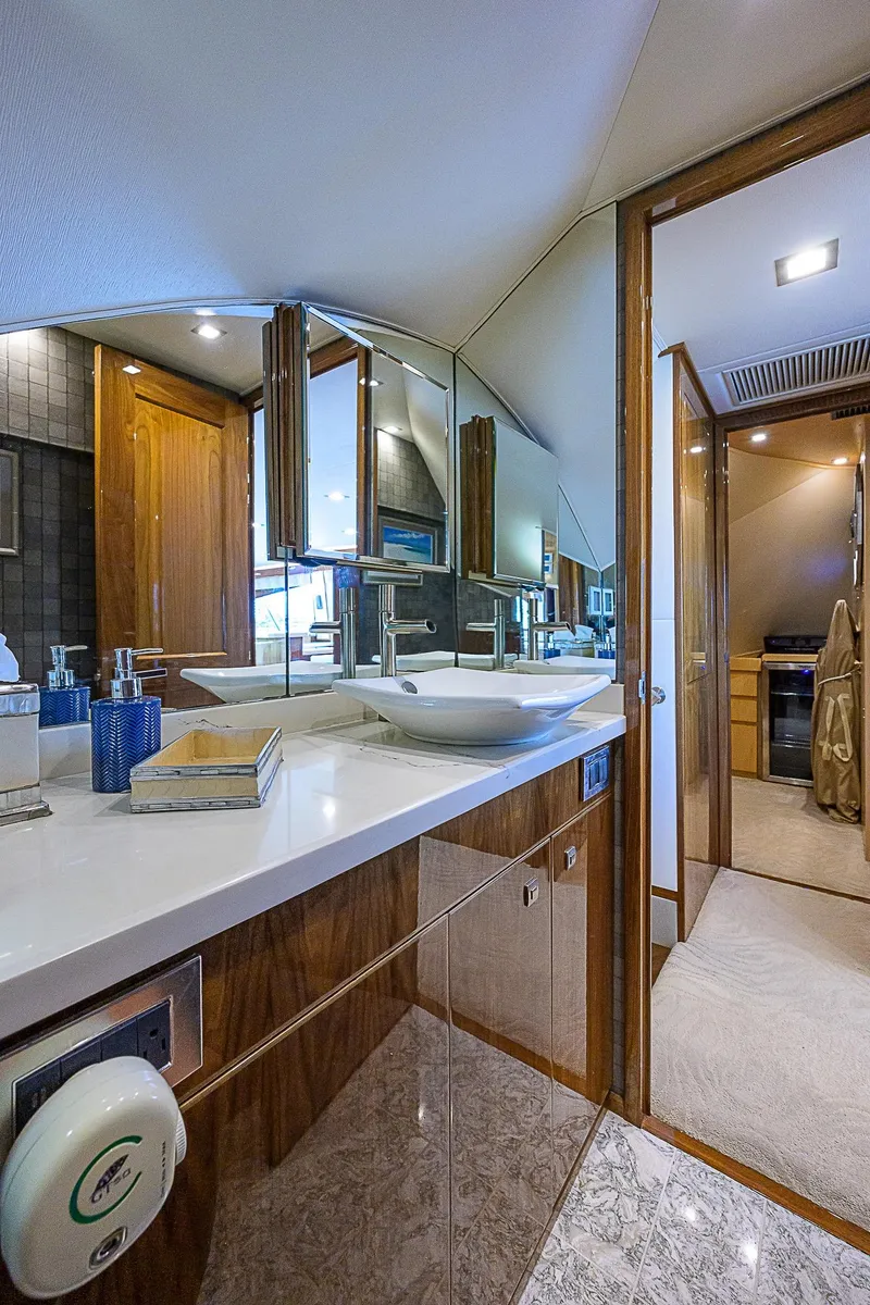 Slide: The Image of Luxurious bathroom in 2018 Viking 92 Sky Bridge yacht with modern fixtures. - 33