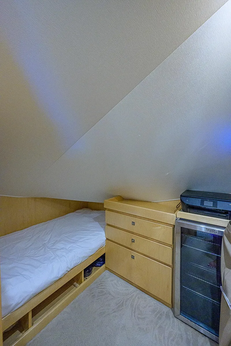 Slide: The Image of Cozy cabin bed in 2018 Viking 92 Sky Bridge yacht with storage drawers. - 34