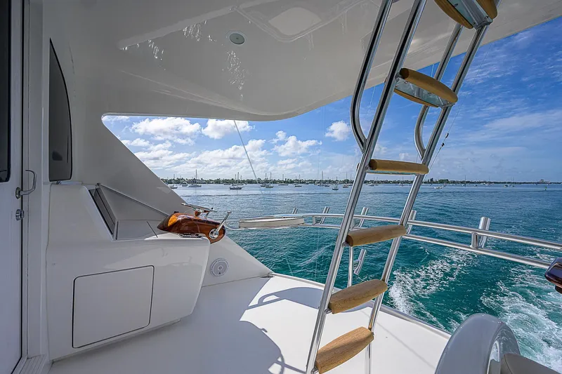 Slide: The Image of 2018 Viking 92 Sky Bridge yacht with ocean view and ladder. - 39