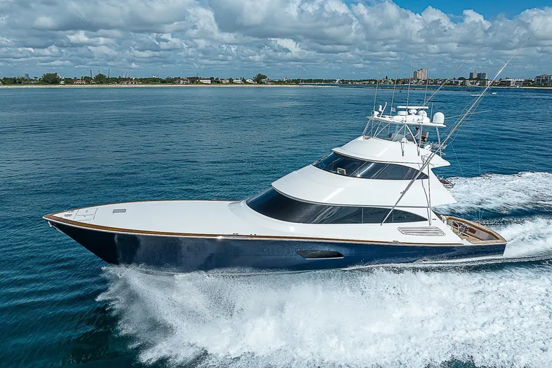 Slide: The Image of 2018 Viking 92 Sky Bridge yacht cruising on open water. - 4