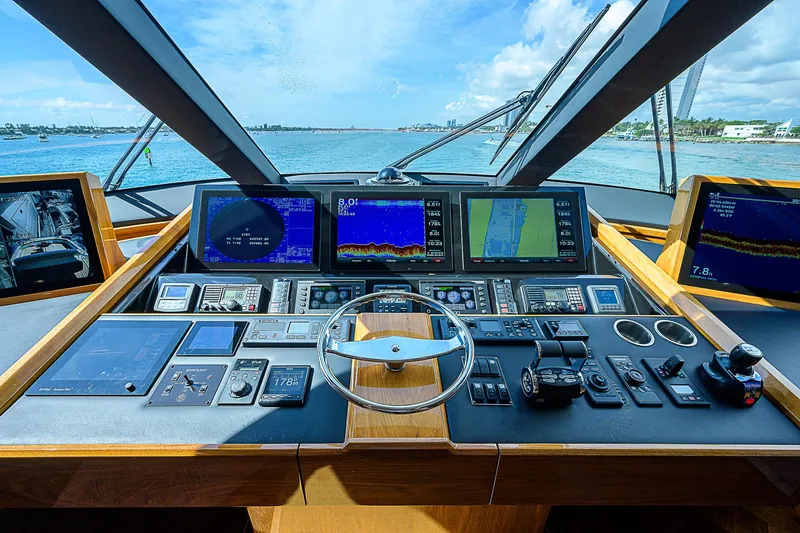 Slide: The Image of Cockpit view of 2018 Viking 92 Sky Bridge yacht with advanced navigation systems. - 41