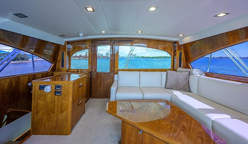 Slide: The Image of Luxurious interior of a 2018 Viking 92 Sky Bridge yacht with panoramic windows. - 48