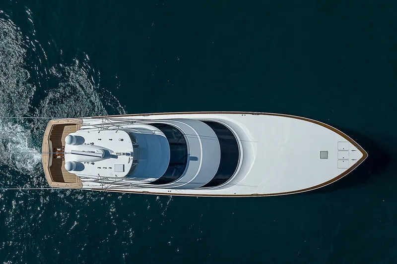 Slide: The Image of Aerial view of 2018 Viking 92 Sky Bridge yacht cruising on the ocean. - 7