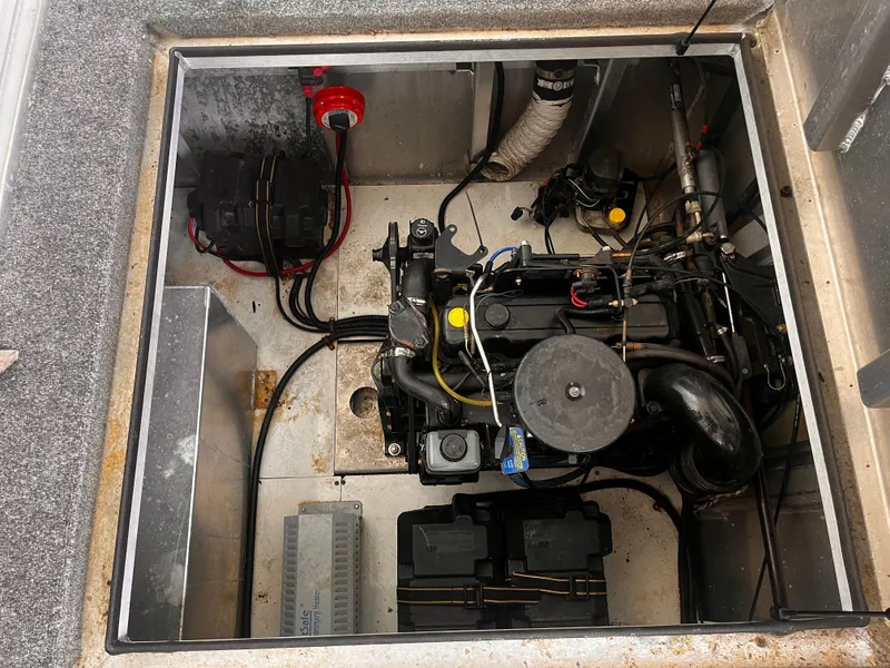 Slide: The Image of Engine compartment of a 2004 Starlight 68X16 boat with visible components. - 23