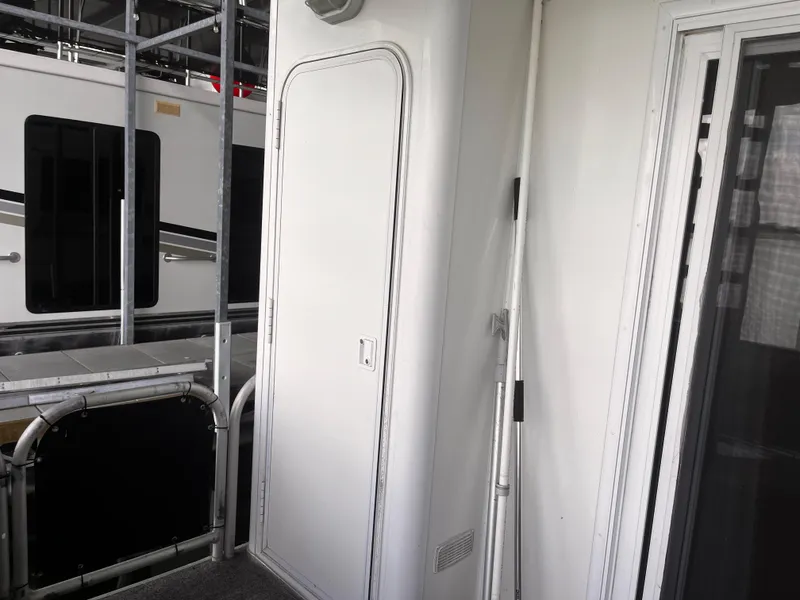 Slide: The Image of 2004 Starlight 68X16 houseboat exterior with door and railing. - 25