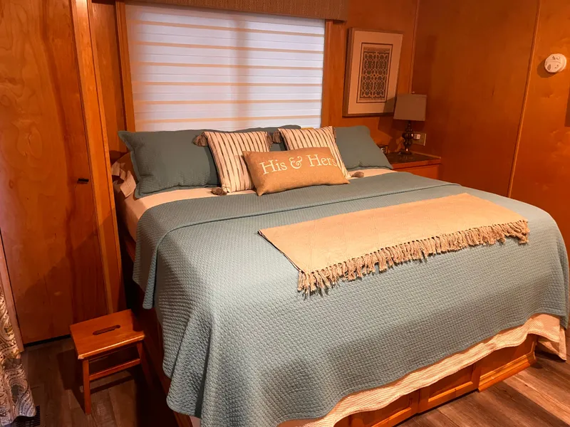 Slide: The Image of Cozy bedroom in 2004 Starlight 68X16 with teal bedding and His & Hers pillows. - 27