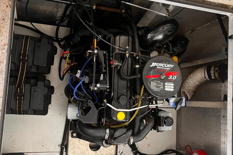 Slide: The Image of Engine compartment of a 2004 Starlight 68X16 boat with a Mercury MerCruiser 3.0 motor. - 30