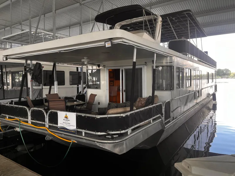 Slide: The Image of 2004 Starlight 68X16 houseboat docked in a covered marina. - 6
