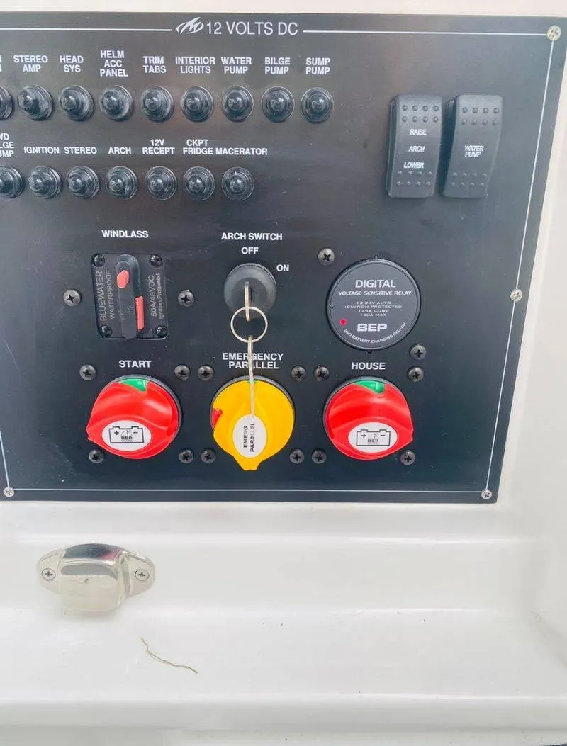 Slide: The Image of Control panel of a 2023 Monterey 298SS boat with various switches and dials. - 12