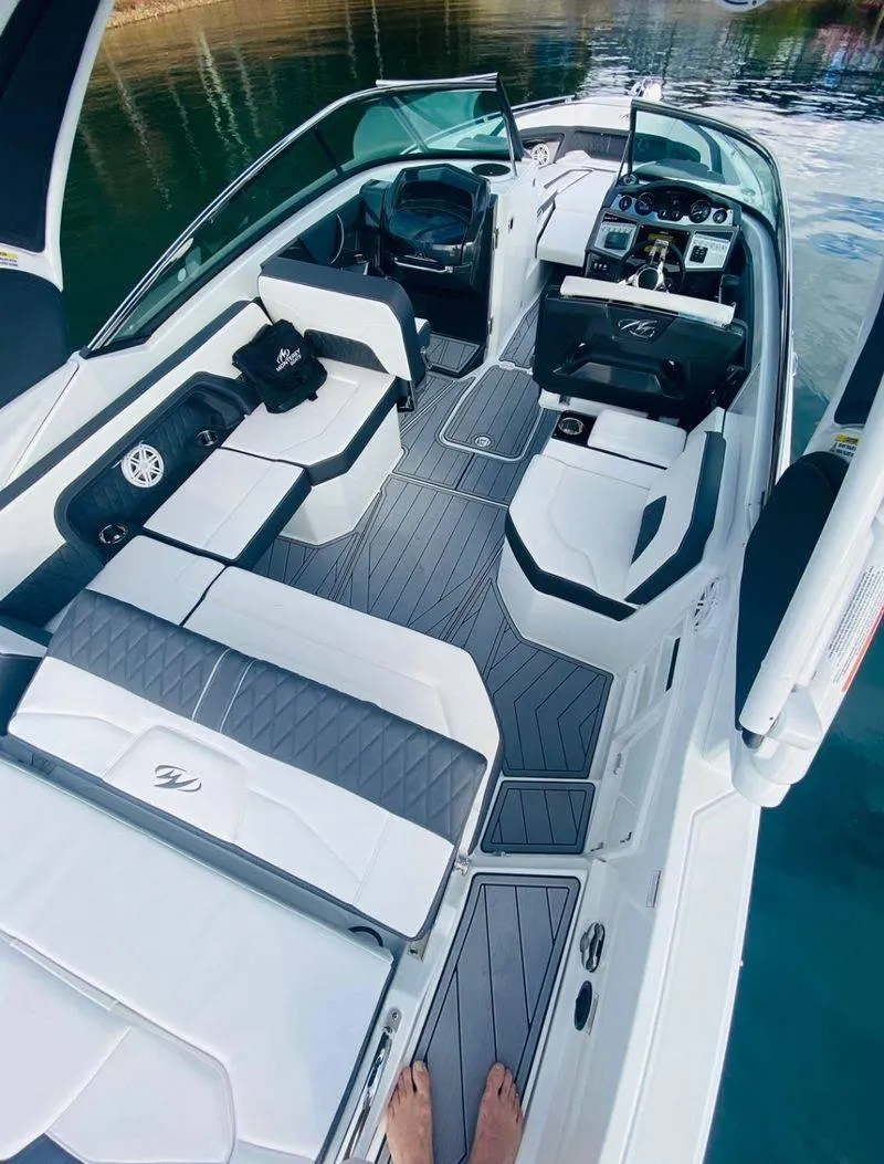 Slide: The Image of 2023 Monterey 298SS boat interior with modern seating and dashboard. - 17