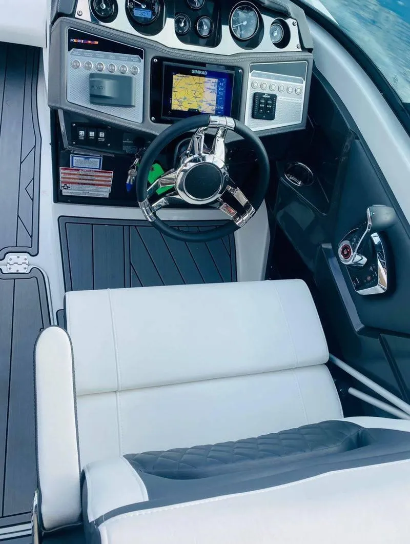Slide: The Image of 2023 Monterey 298SS boat cockpit with modern controls and navigation system. - 6