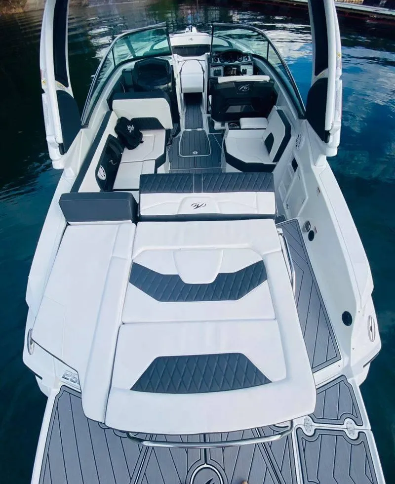 Slide: The Image of 2023 Monterey 298SS boat interior with white and gray seating and deck. - 8