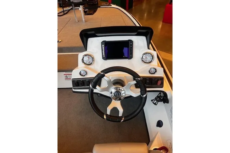 Slide: The Image of 2024 Nitro Z18 Pro boat dashboard with steering wheel and electronic display. - 61