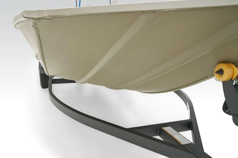 Slide: The Image of 2024 Tracker Grizzly 1860 CC boat on snowy trailer, parked near clock tower. - 6