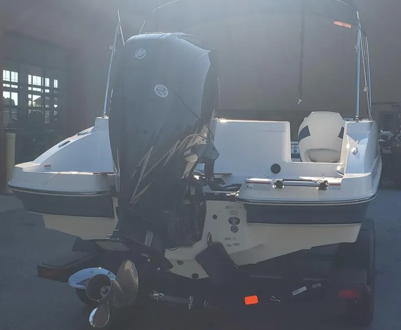 Slide: The Image of 2024 Tahoe 2150 boat with powerful outboard motor, rear view. - 2