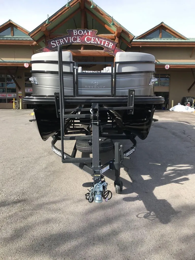 Slide: The Image of 2024 Regency 250 LE3 boat at service center entrance. - 4