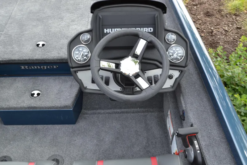 Slide: The Image of 2024 Ranger RT198P boat dashboard with steering wheel and Humminbird electronics. - 3
