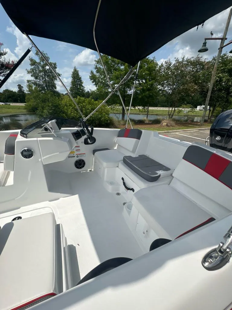 Slide: The Image of 2024 Tahoe T16 boat interior with seating and canopy. - 5