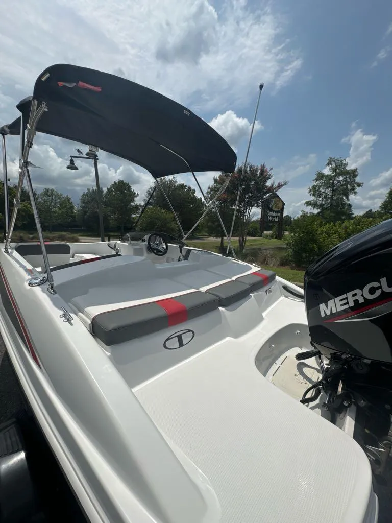 Slide: The Image of 2024 Tahoe T16 boat with Mercury outboard motor and canopy. - 6