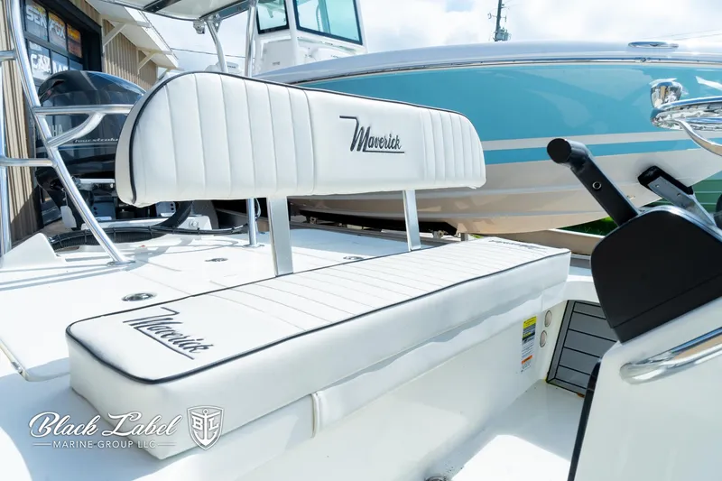 Slide: The Image of 2024 Maverick HPX-S 17 boat interior with white cushioned seating. - 12