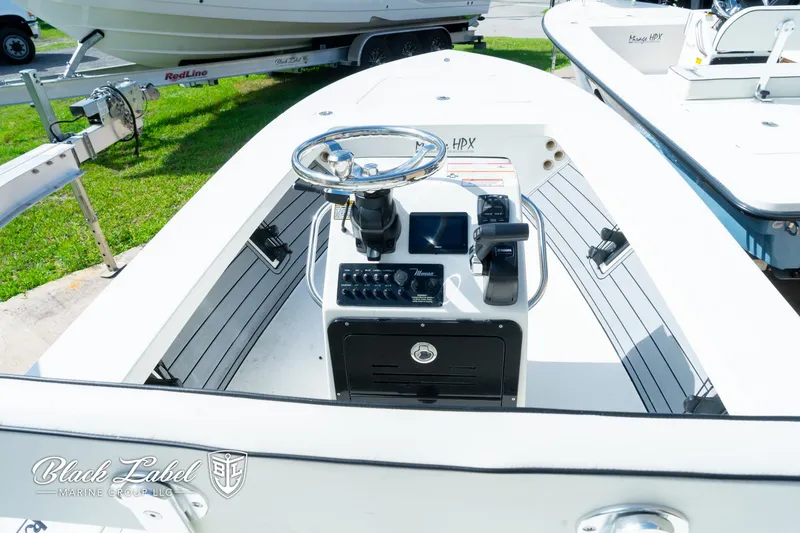 Slide: The Image of 2024 Maverick HPX-S 17 boat interior with steering console and controls. - 13