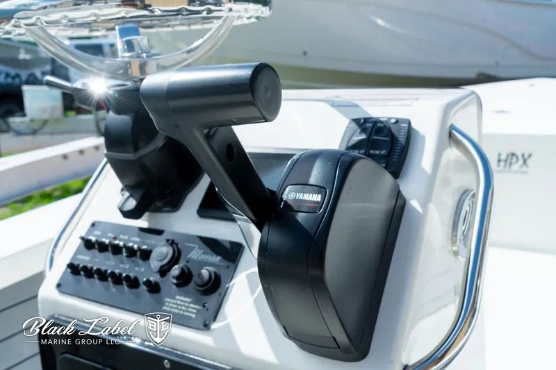 Slide: The Image of Close-up of 2024 Maverick HPX-S 17 boat control panel with Yamaha throttle. - 16