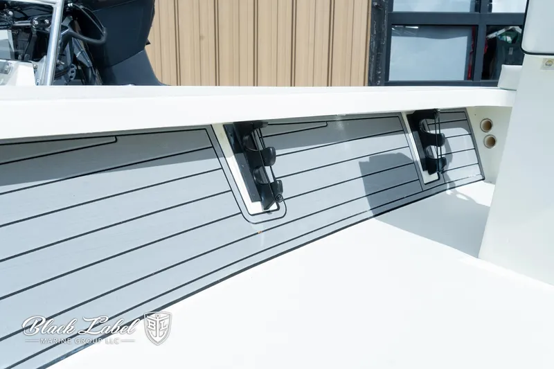 Slide: The Image of 2024 Maverick HPX-S 17 boat interior with rod holders and sleek design. - 21