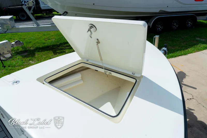 Slide: The Image of 2024 Maverick HPX-S 17 boat storage compartment open. - 24