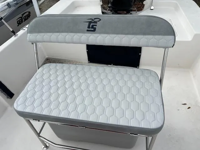 Slide: The Image of 2024 Carolina Skiff EV218 Sea Skiff bench seat with hexagonal pattern upholstery. - 4