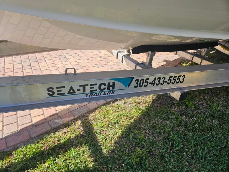 Slide: The Image of Sea Hunt Gamefish 25 boat on Sea-Tech trailer, contact 305-433-5553. - 11