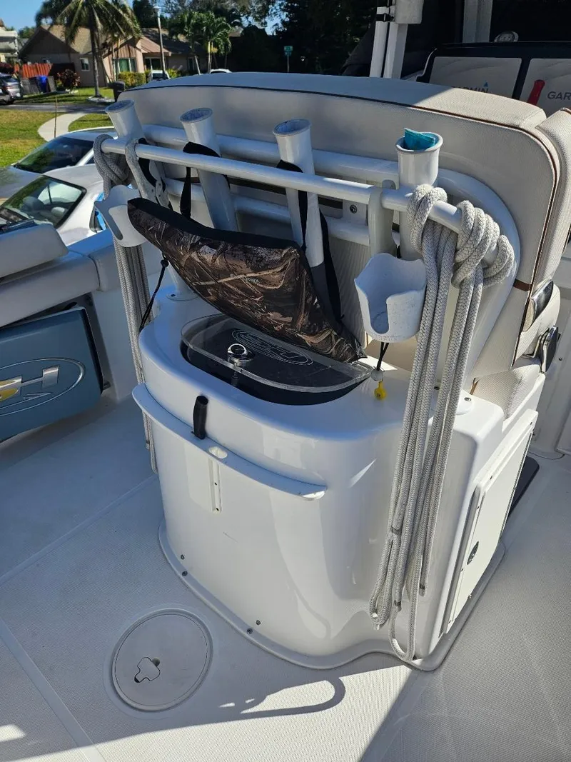 Slide: The Image of 2021 Sea Hunt Gamefish 25 boat with fishing rod holders and storage. - 16