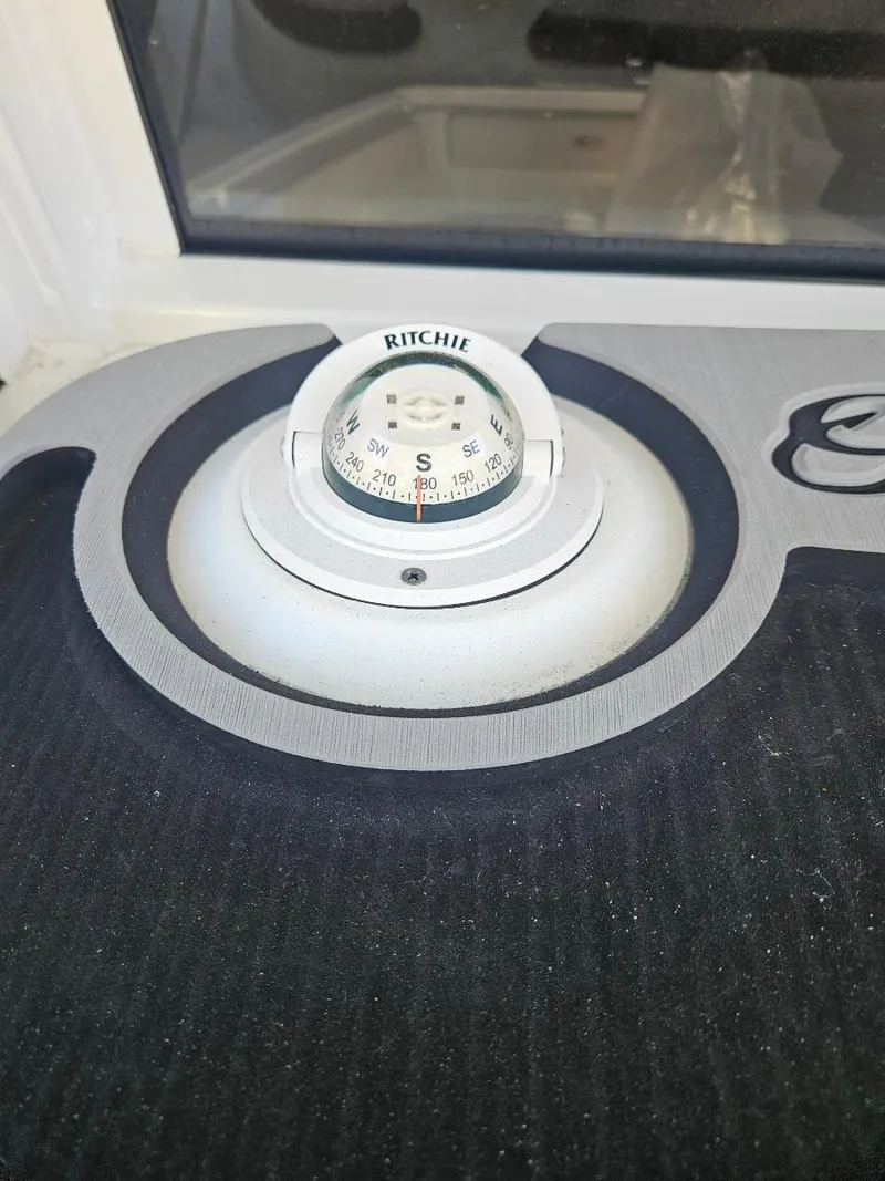Slide: The Image of Ritchie compass on 2021 Sea Hunt Gamefish 25 boat dashboard. - 18