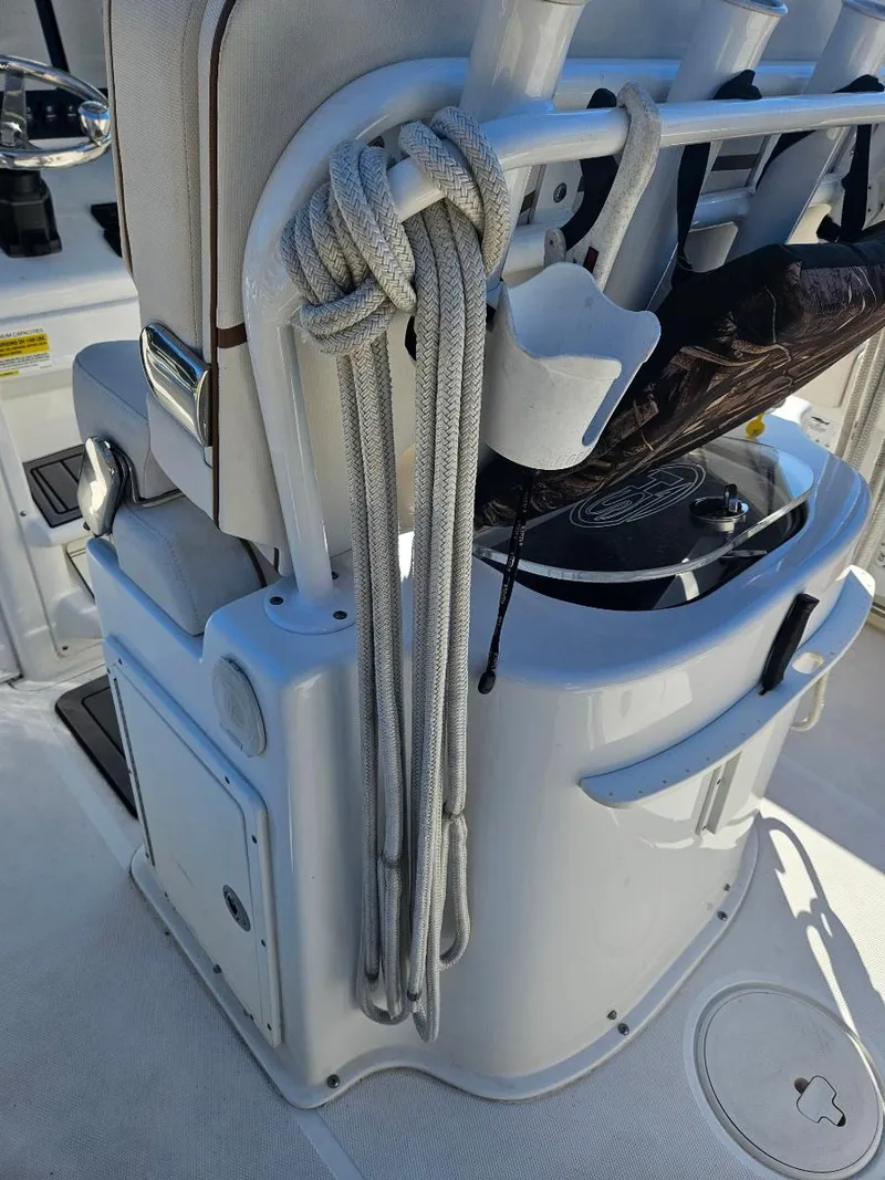 Slide: The Image of 2021 Sea Hunt Gamefish 25 boat interior with fishing equipment and storage. - 20