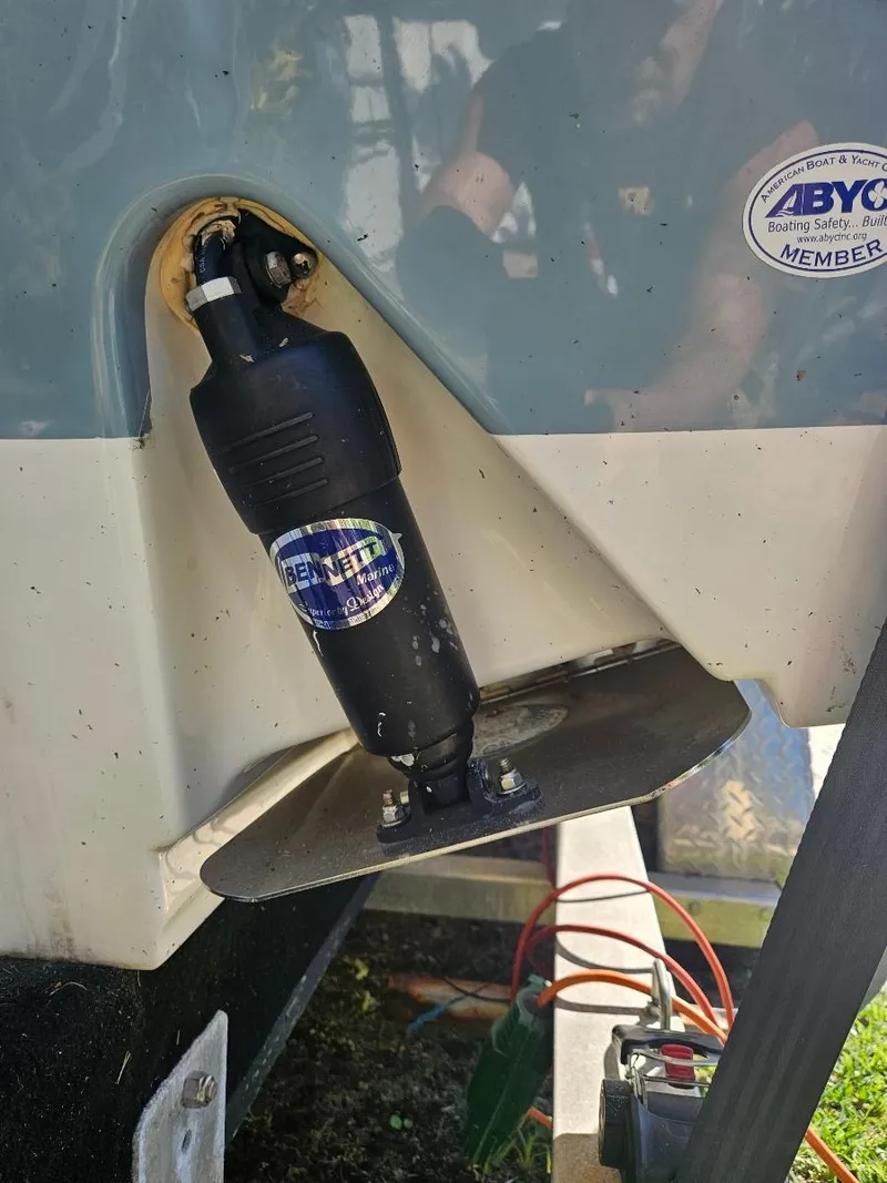 Slide: The Image of 2021 Sea Hunt Gamefish 25 boat trim tab actuator close-up. - 24