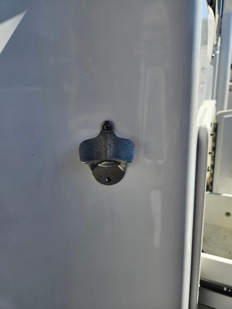 Slide: The Image of Bottle opener on 2021 Sea Hunt Gamefish 25 boat. - 27