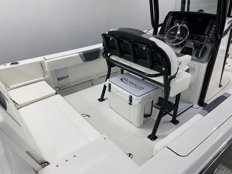 Slide: The Image of 2024 Robalo R232 Explorer boat interior with seating and console. - 10