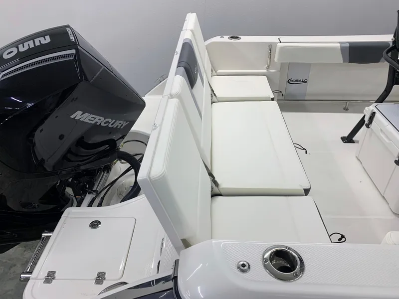 Slide: The Image of 2024 Robalo R232 Explorer boat with Mercury outboard engine and white seating. - 12