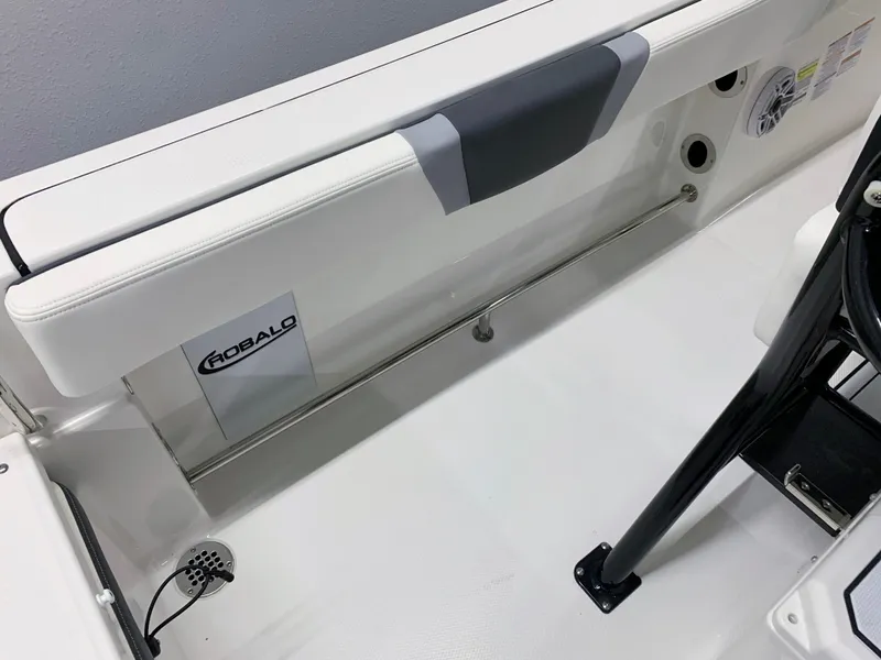 Slide: The Image of 2024 Robalo R232 Explorer boat interior, white seating and stainless steel rail. - 19