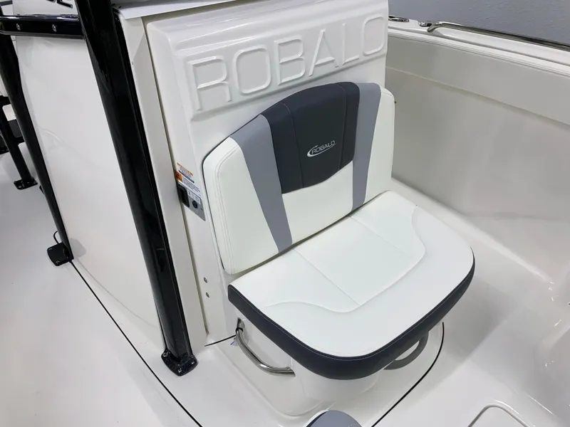Slide: The Image of 2024 Robalo R232 Explorer boat seat with white and gray upholstery. - 29