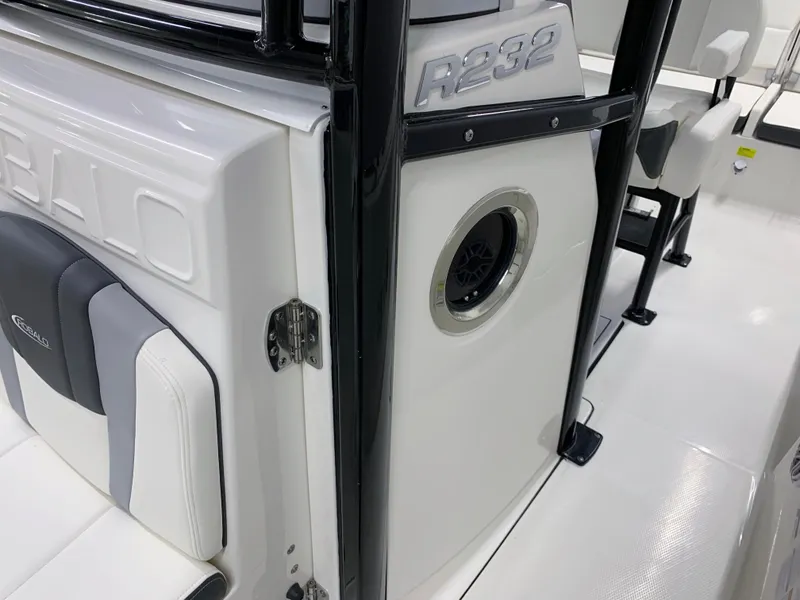 Slide: The Image of 2024 Robalo R232 Explorer boat interior, featuring seating and speaker details. - 31