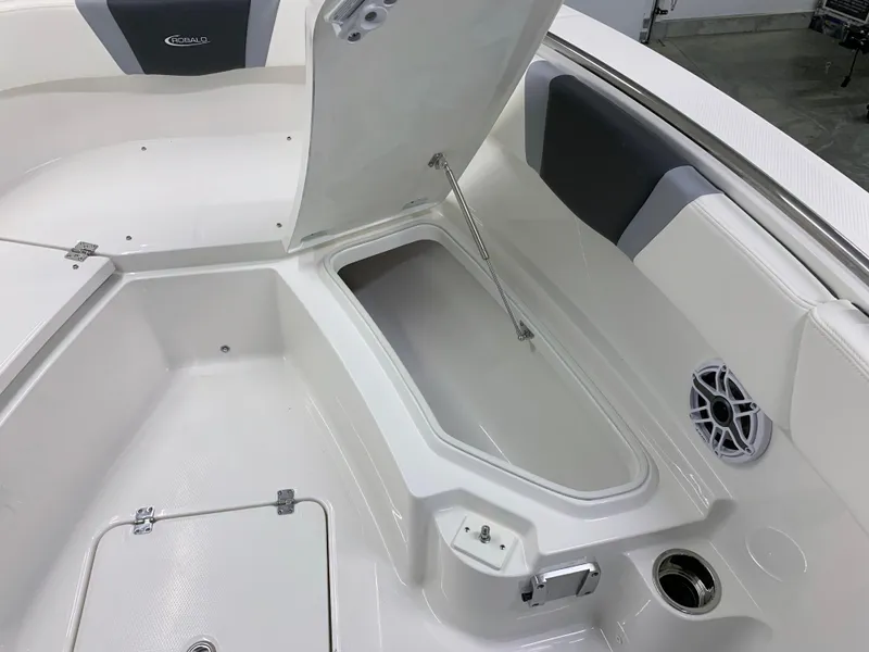 Slide: The Image of 2024 Robalo R232 Explorer boat interior with open storage compartment. - 35