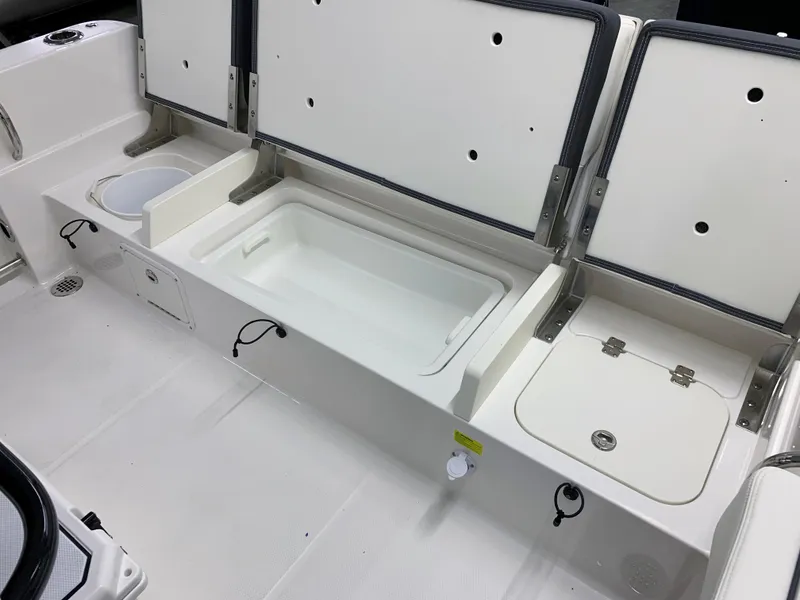 Slide: The Image of 2024 Robalo R232 Explorer boat storage compartments and livewell. - 36