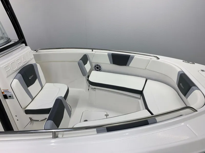 Slide: The Image of 2024 Robalo R232 Explorer boat interior with cushioned seating and modern design. - 5