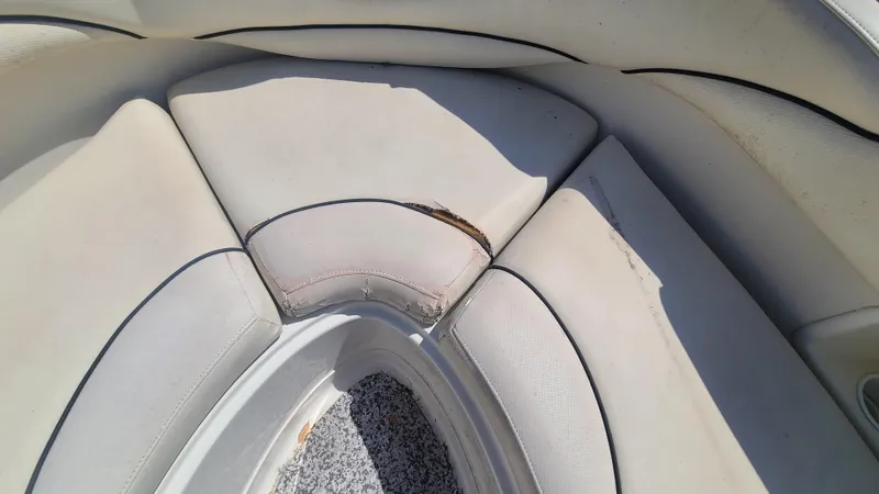 Slide: The Image of 2004 Monterey 268 SS Open Bow Sport boat with worn and torn upholstery. - 11