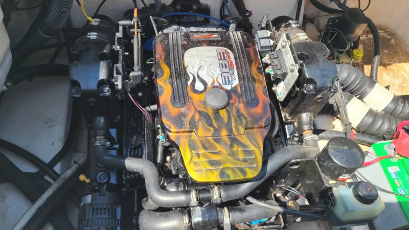 Slide: The Image of 2004 Monterey 268 SS Open Bow Sport boat engine with custom flame design. - 23