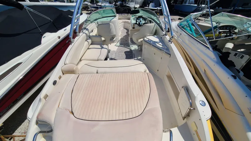 Slide: The Image of 2004 Monterey 268 SS Open Bow Sport boat interior with seating and steering console. - 27