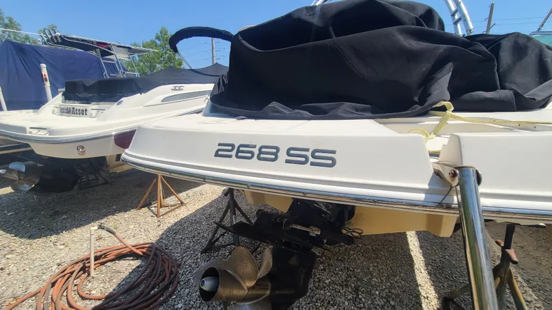 Slide: The Image of 2004 Monterey 268 SS Open Bow Sport boat, rear view with propeller and cover. - 6