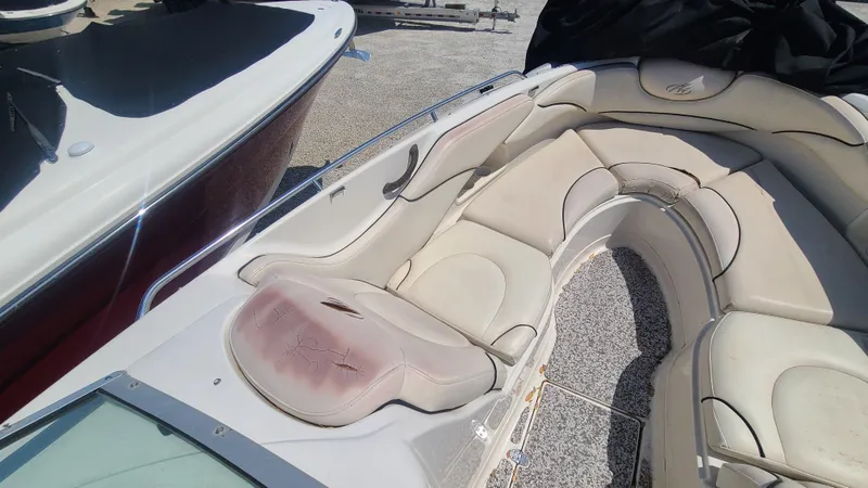 Slide: The Image of 2004 Monterey 268 SS Open Bow Sport boat with beige seating. - 9