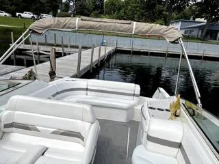 Slide: The Image of 2001 Formula 280 Bow Rider boat with white seating, docked by a wooden pier. - 11